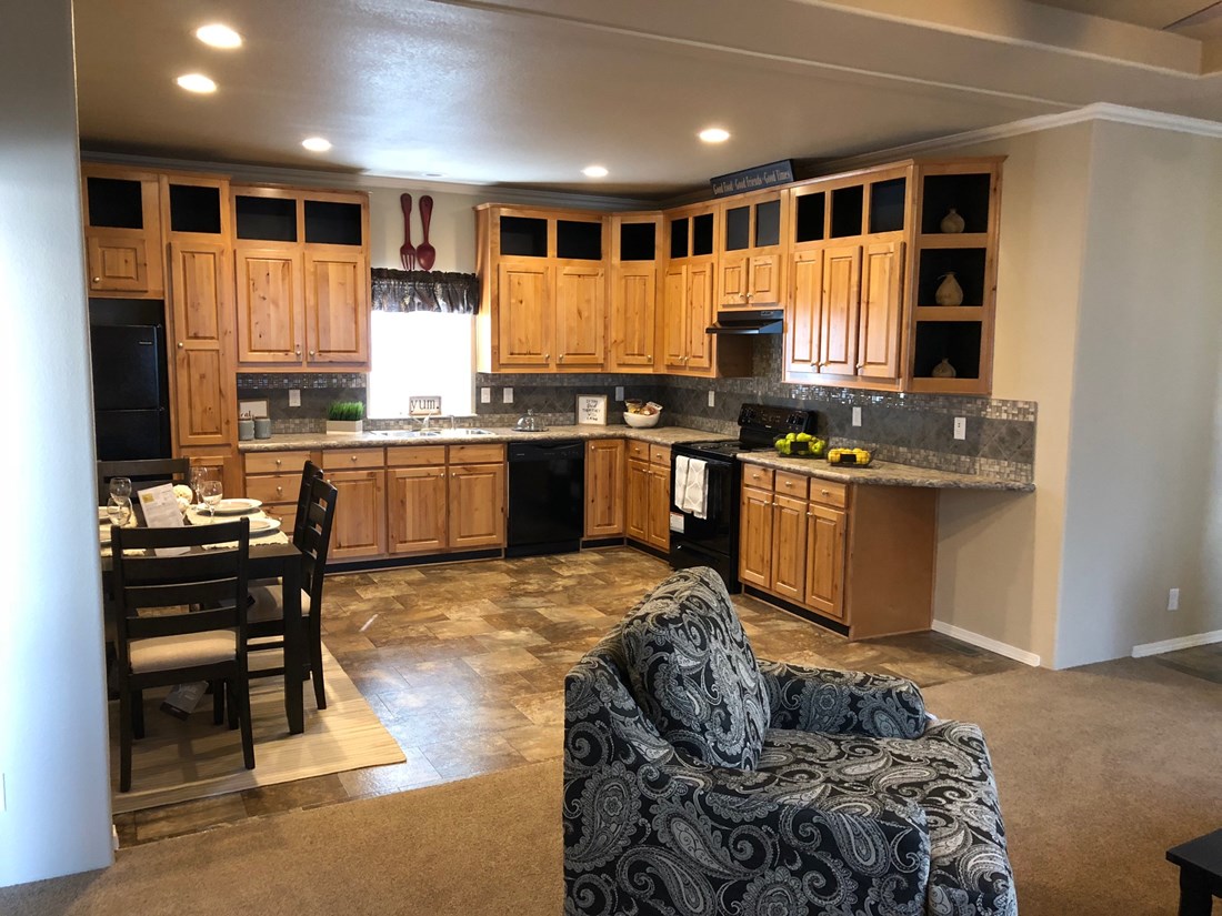 The THE FRASER Kitchen. This Manufactured Mobile Home features 3 bedrooms and 2 baths.