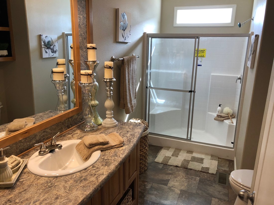 The THE FRASER Primary Bathroom. This Manufactured Mobile Home features 3 bedrooms and 2 baths.