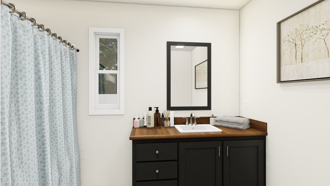 The DRM483F 48'              DREAM Primary Bathroom. This Manufactured Mobile Home features 3 bedrooms and 2 baths.