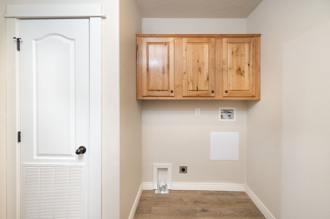 The TH601F                 CLAYTON Utility Room. This Manufactured Mobile Home features 3 bedrooms and 2 baths.