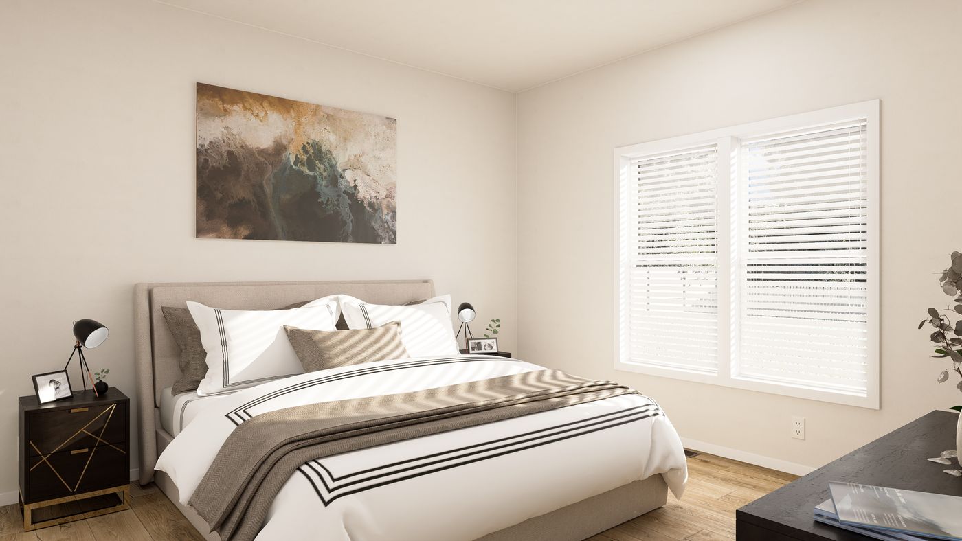 The PREFERRED PLUS CP561F Primary Bedroom. This Manufactured Mobile Home features 3 bedrooms and 2 baths.