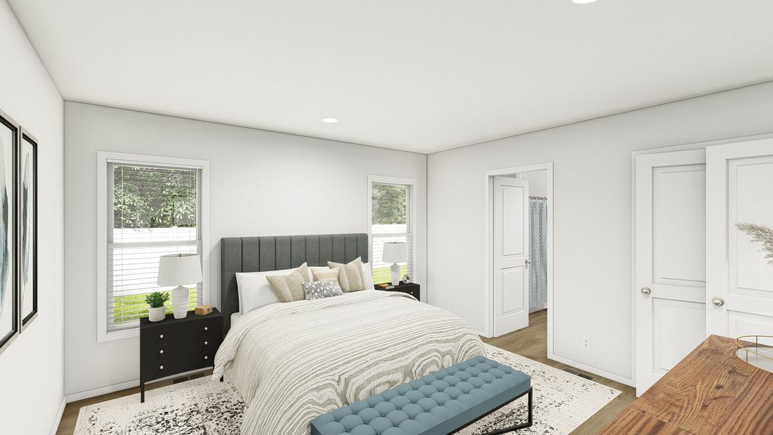 The DRM484F 48'              DREAM Primary Bedroom. This Manufactured Mobile Home features 4 bedrooms and 2 baths.