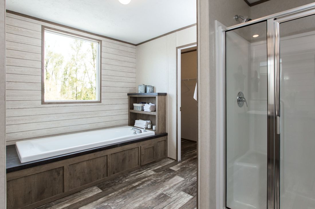 The THE BREEZE 2.5         CLAYTON Primary Bathroom. This Manufactured Mobile Home features 4 bedrooms and 2 baths.