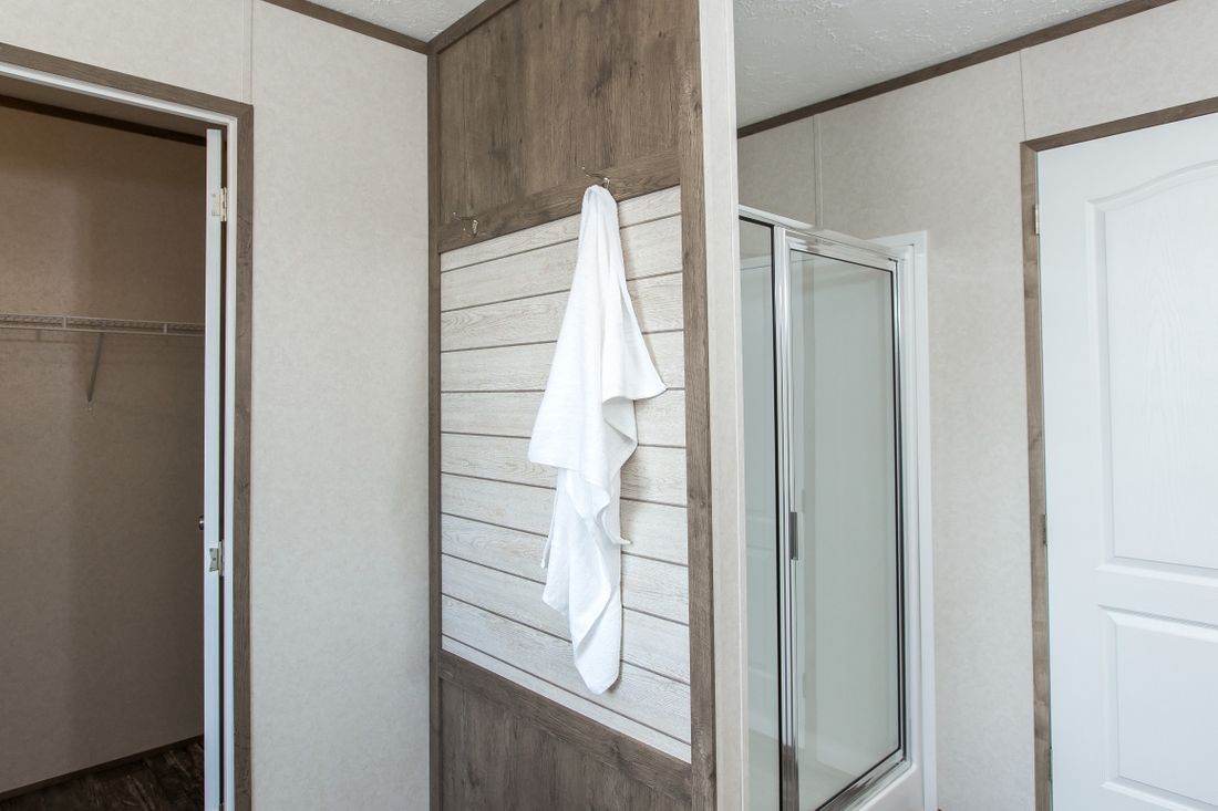 The THE BREEZE 2.5         CLAYTON Primary Bathroom. This Manufactured Mobile Home features 4 bedrooms and 2 baths.