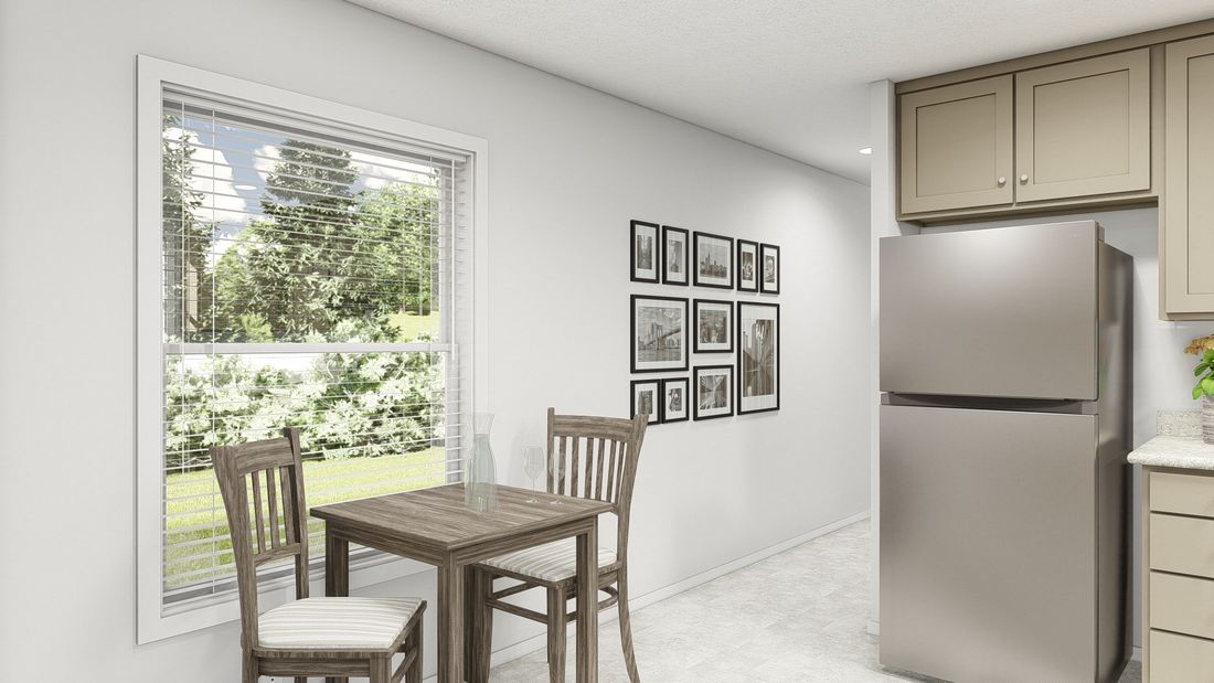 The DRM603N 1560'            DREAM Dining Area. This Manufactured Mobile Home features 2 bedrooms and 2 baths.