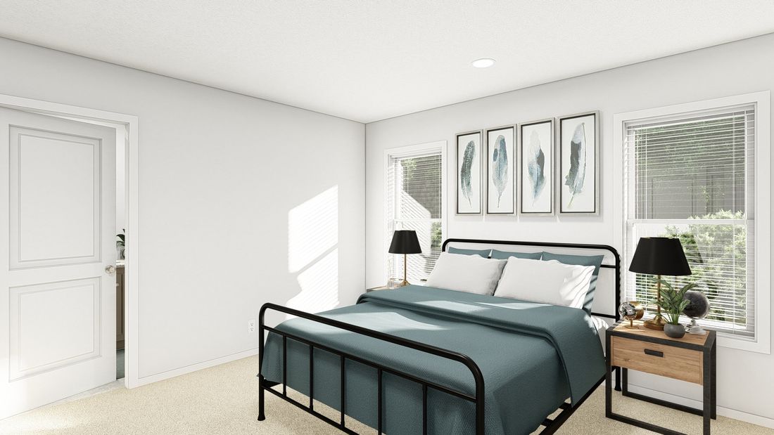 The DRM603N 1560'            DREAM Primary Bedroom. This Manufactured Mobile Home features 2 bedrooms and 2 baths.