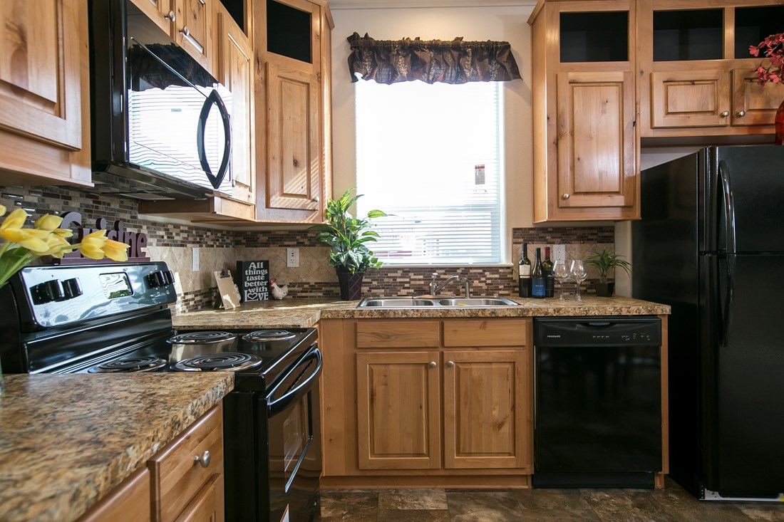 The ING382F REDWOOD II   (FULL) GW Kitchen. This Manufactured Mobile Home features 2 bedrooms and 2 baths.